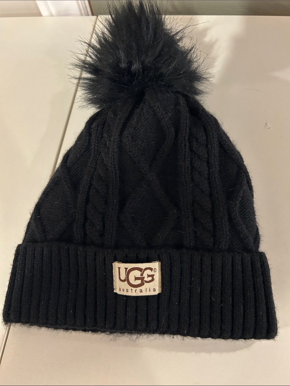 UGG Black Cable-Knit Pom Beanie with Logo Patch